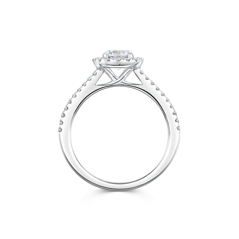 side angle of silver coloured halo engagement ring