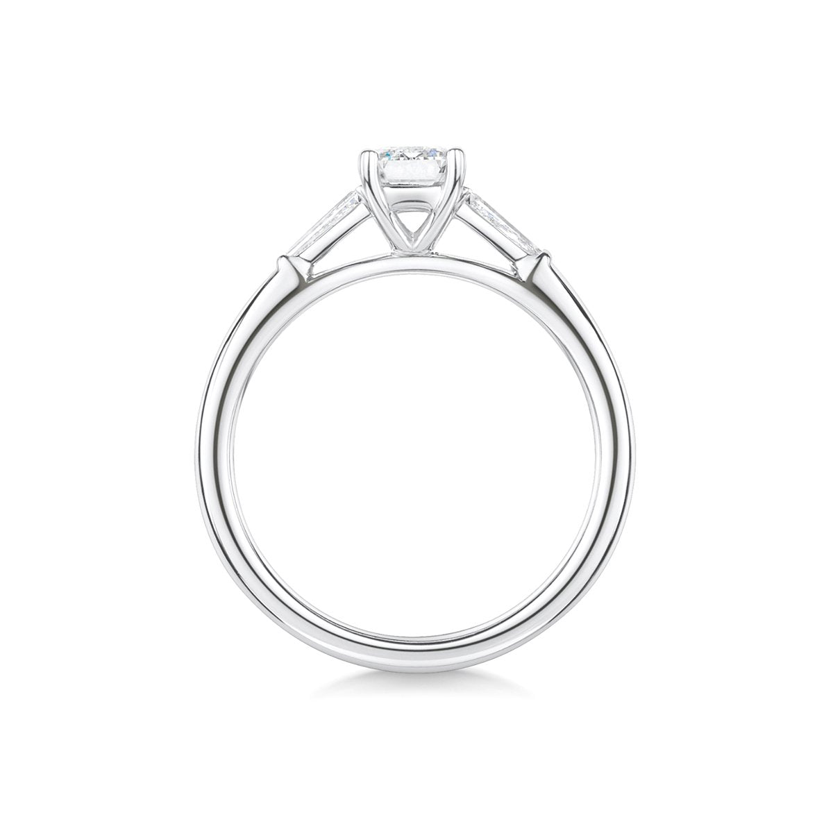 side profile of platinum and emerald cut with baguette cut shoulder three stone engagement ring