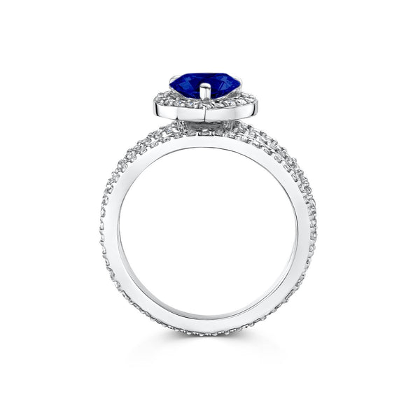 side angle of Ring with heart shaped blue sapphire set within a scintillating diamond halo
