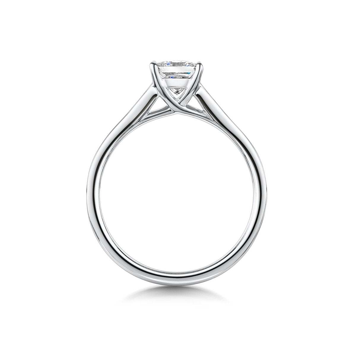 side angle of round brilliant cut engagement ring with elegant baguette cut diamond shoulders