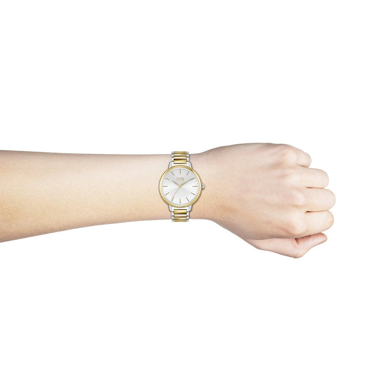 two tone Hugo Boss ladies watch with silver dial and gold tone hour markers on a wrist