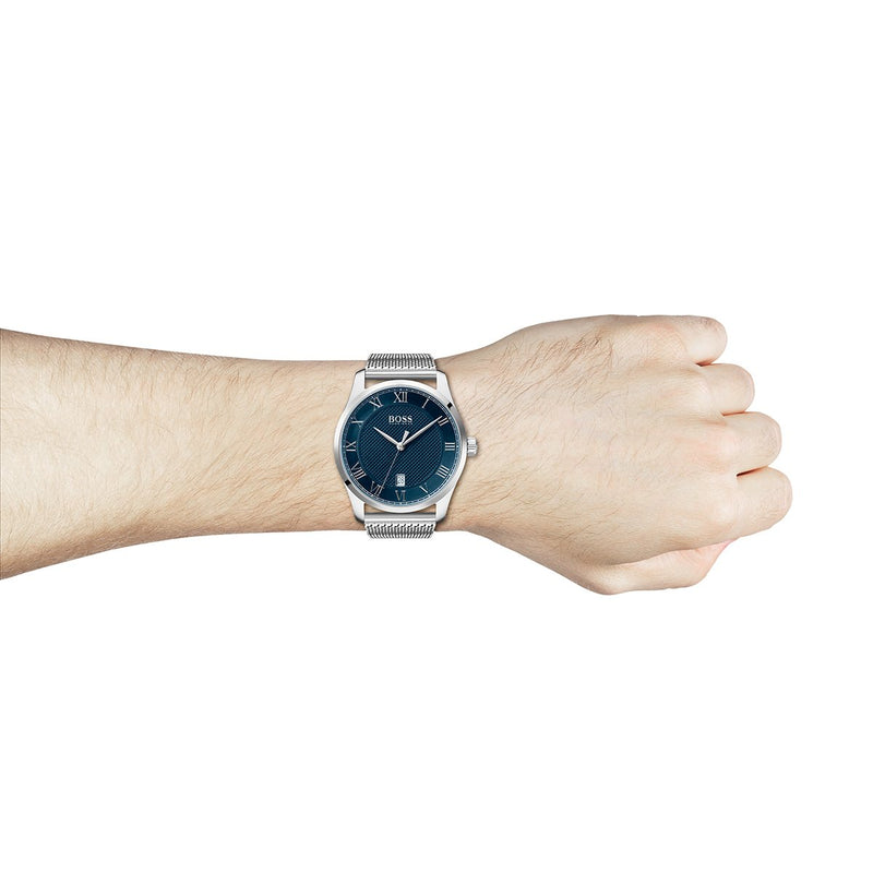 mesh bracelet Hugo Boss watch with Roman numerals and a blue dial on a wrist
