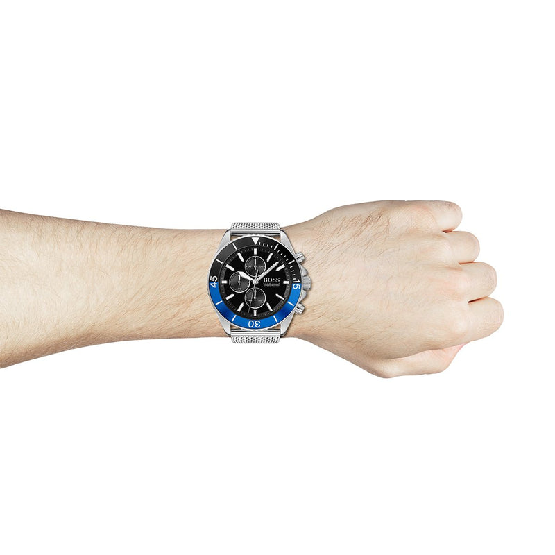 silver strap black and blue bezel chronograph dial Hugo Boss watch on the wrist