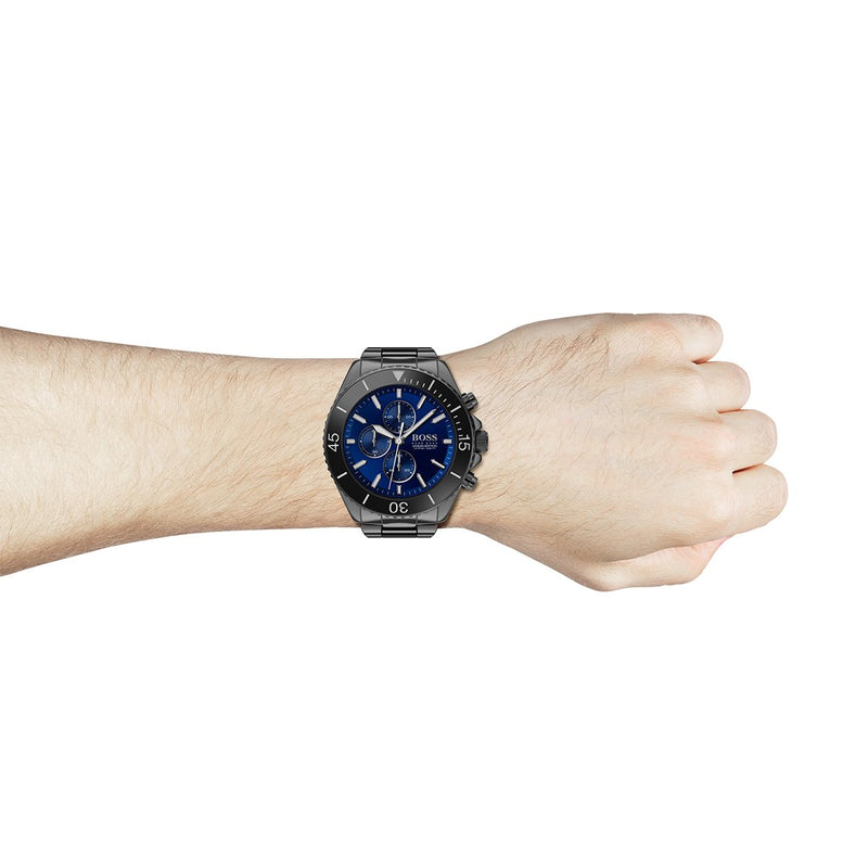 blue chronograph dial Hugo Boss watch with black case and bracelet on wrist