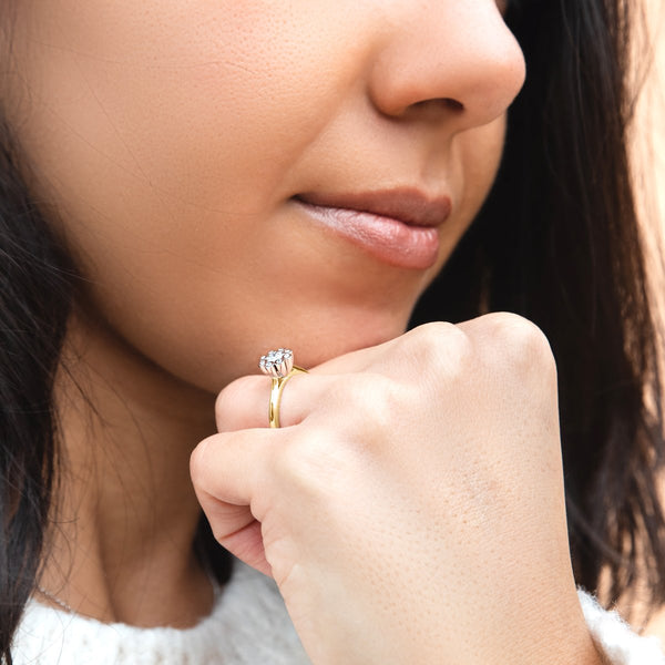 lady wearing yellow gold diamond engagement ring shaped as Dandelion
