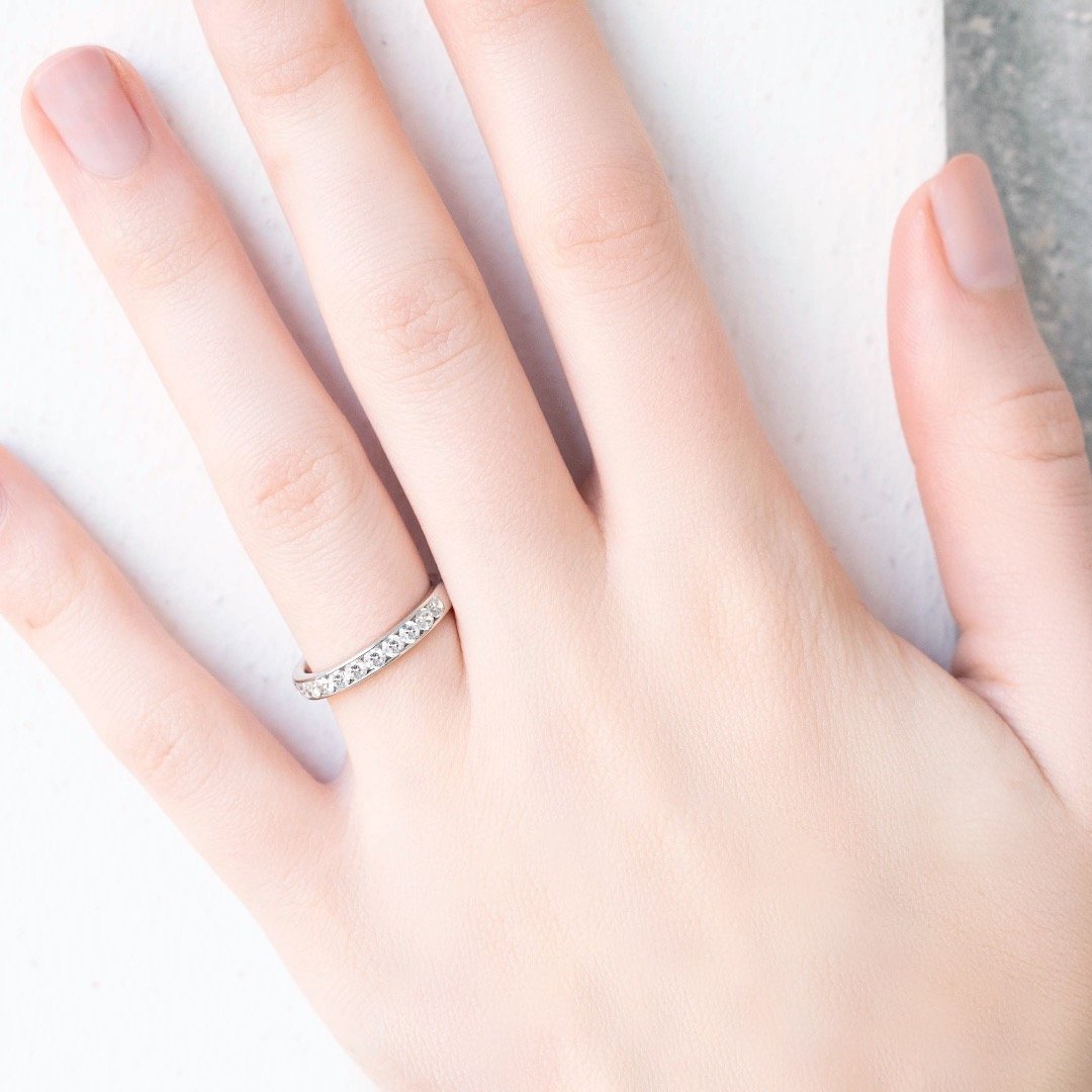 lady wearing diamond eternity band in. platinum