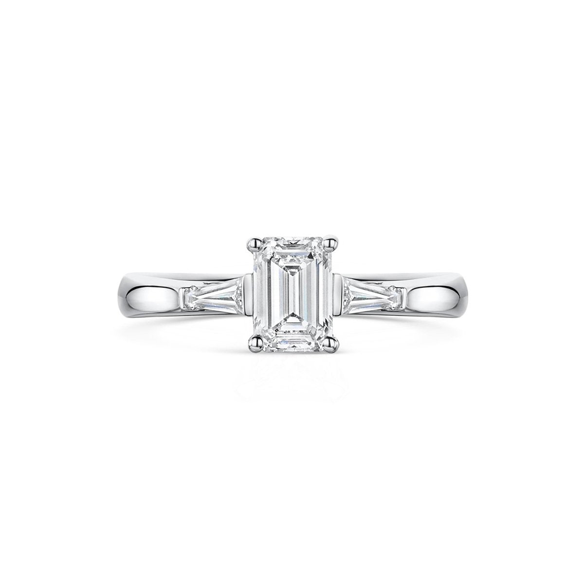 platinum and emerald cut with baguette cut shoulder three stone engagement ring