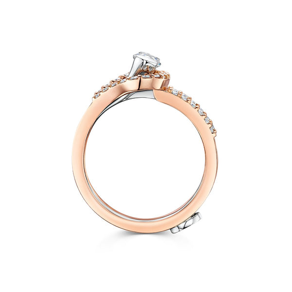 side angle of  ring with marquise cut diamond set within 18k rose gold wrap