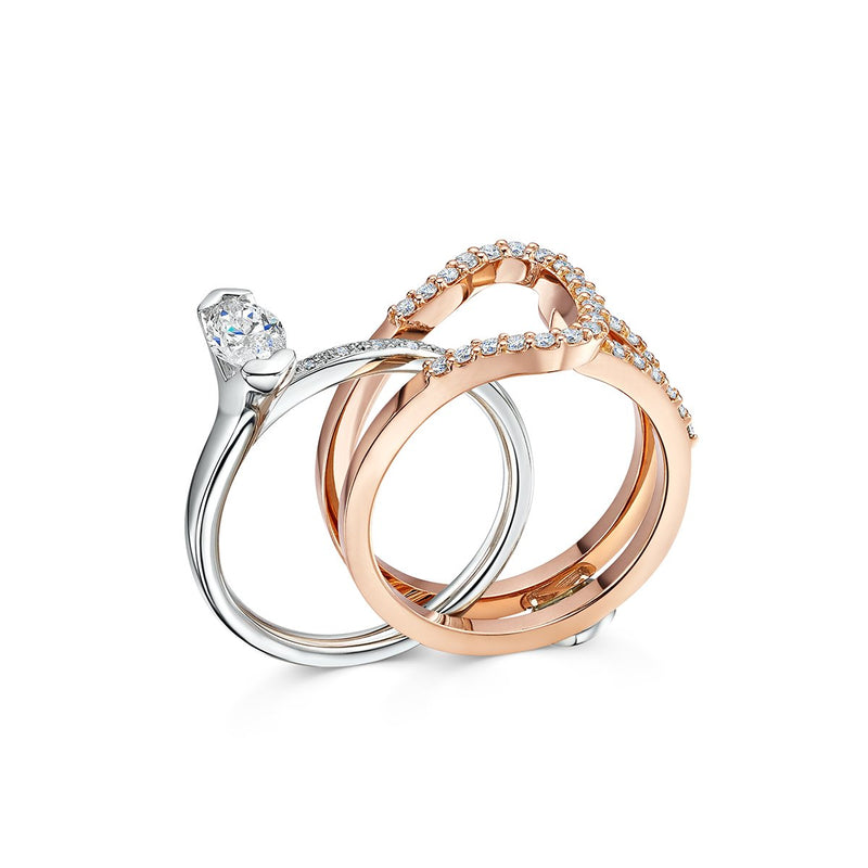 two parts of  ring with marquise cut diamond set within 18k rose gold wrap