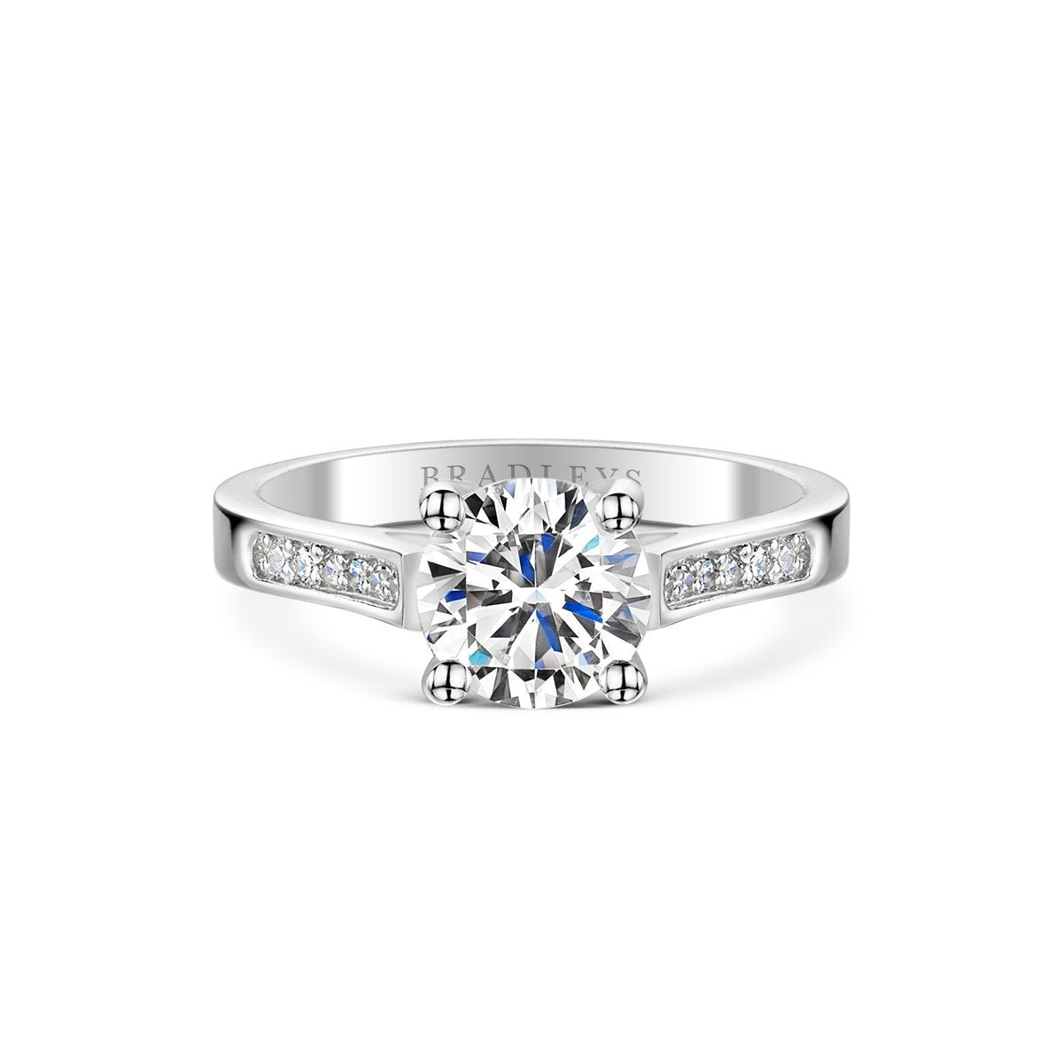 silver coloured diamond engagement ring with diamond shoulders.