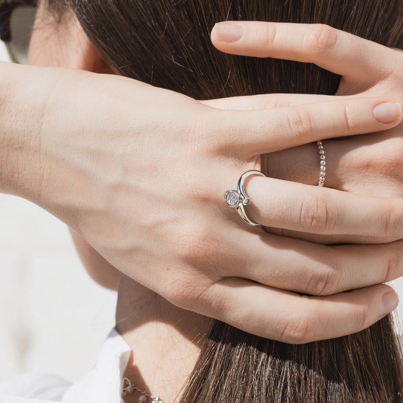 lady wearing diamond ring with two organic looking platinum pods